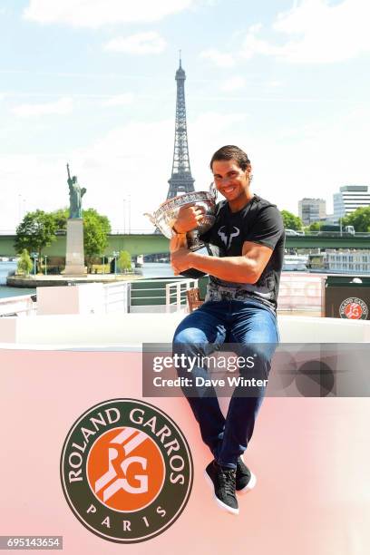 Rafael Nadal of Spain poses during a photocall to celebrate his record breaking 10th French Open title at Quai de Grenelle on June 12, 2017 in Paris,...