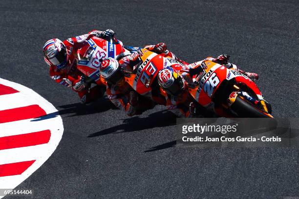 Dani Pedrosa and Marc Marquez of Repsol Honda Team and Andrea Dovizioso of Ducati Team , riding his bikes during the Moto GP race, Moto GP of...