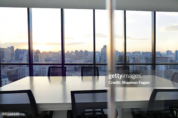 meeting room with cityscape and sunset - focus on background bildbanksfoton och bilder