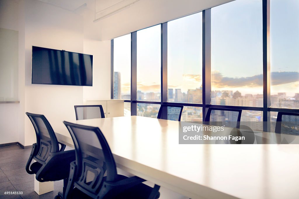 Meeting room with view of cityscape sunset