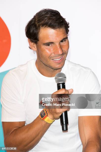 Rafael Nadal attends a promotional event at the 'Nike Store' on the Champs-Elysees avenue, one day after winning the men's Roland Garros 2017 French...
