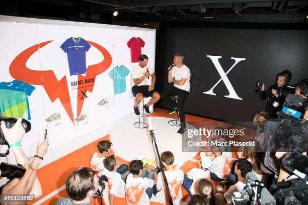 Rafael Nadal attends a promotional event at the 'Nike Store' on the Champs-Elysees avenue, one day after winning the men's Roland Garros 2017 French...