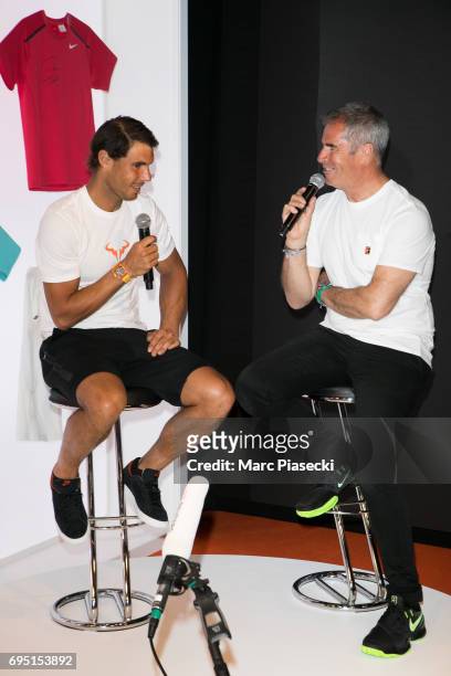 Rafael Nadal attends a promotional event at the 'Nike Store' on the Champs-Elysees avenue, one day after winning the men's Roland Garros 2017 French...