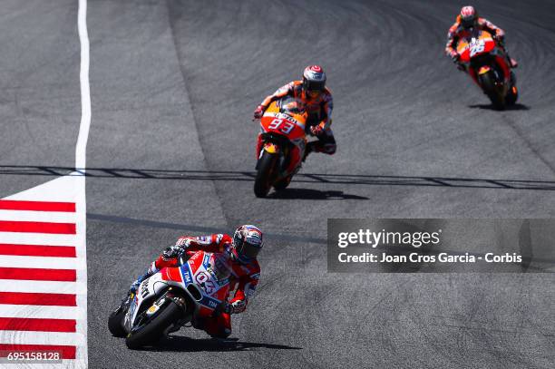 Andrea Dovizioso of Ducati Team and Dani Pedrosa and Marc Marquez of Repsol Honda Team, riding his bikes during the Moto GP race, Moto GP of...