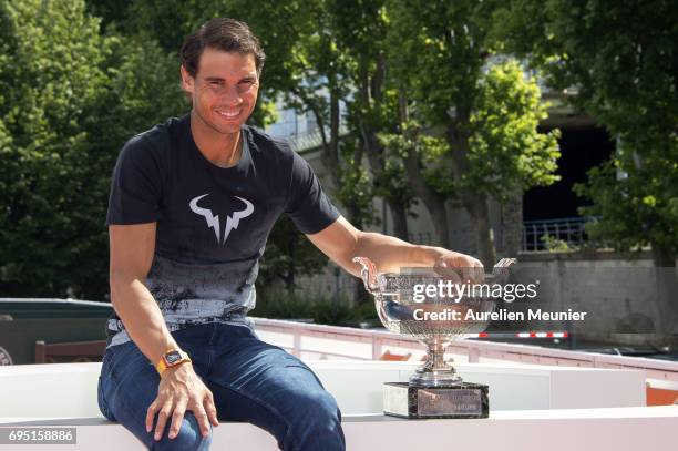 Rafael Nadal of Spain poses with the Mousquetaires Trophy after winning his 10th Roland against Stan Wawrinka of Switzerland on June 12, 2017 in...