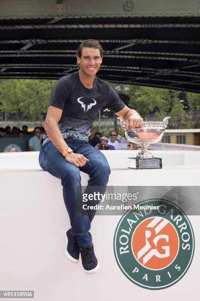 Rafael Nadal of Spain poses with the Mousquetaires Trophy after winning his 10th Roland against Stan Wawrinka of Switzerland on June 12, 2017 in...