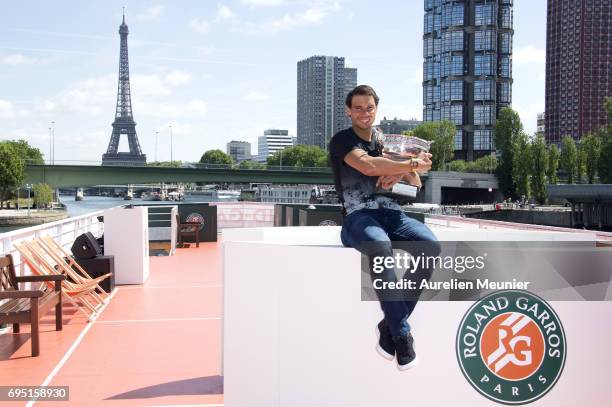 Rafael Nadal of Spain poses with the Mousquetaires Trophy after winning his 10th Roland against Stan Wawrinka of Switzerland on June 12, 2017 in...