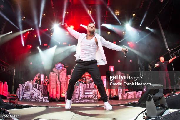 German rapper Maximilian Diehn aka Kontra K performs live on stage during a concert at the Zitadelle Spandau on June 10, 2017 in Berlin, Germany.