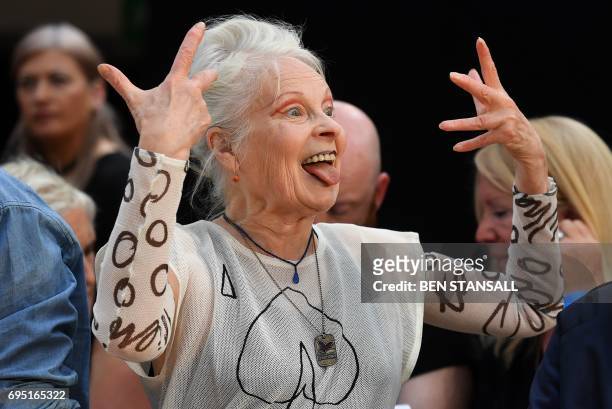 British designer Vivienne Westwood reacts as she talks discusses her catwalk show at before displaying her latest creations at London Fashion Week...