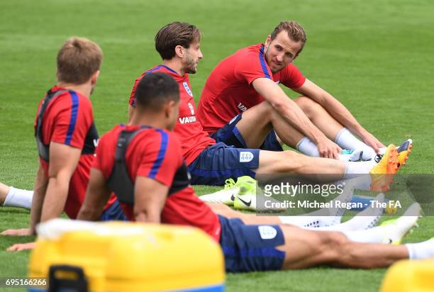 Harry Kane chats with Adam Lallana during the England training session at the Chemin De Ronde Stadium on June 12, 2017 in Croissy-sur-Seine, France.