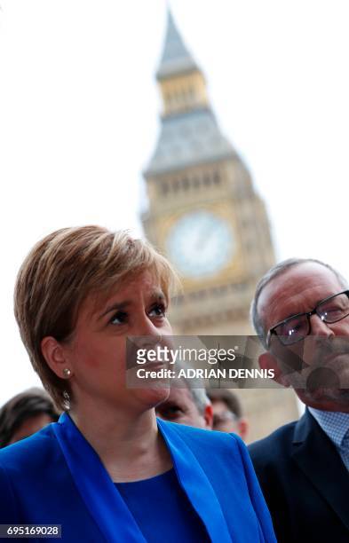 Scotland's First Minister and Scottish National Party leader Nicola Sturgeon speaks to members of the media in front of the Elizabeth Tower, commonly...