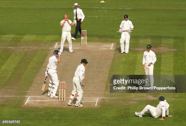 Matthew Hayden of Australia drops Michael Vaughan of England during the 3rd Ashes Test match between Australia and England at Old Trafford in...