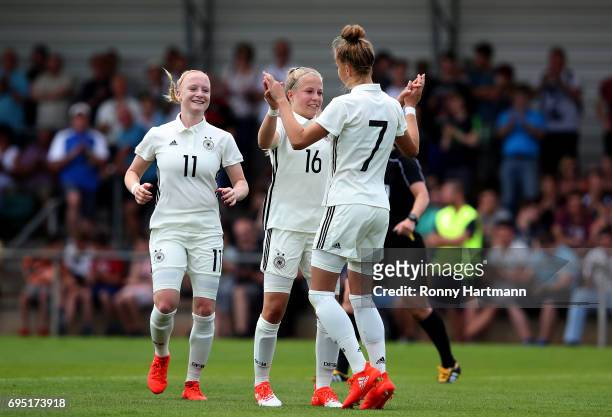 Giulia Gwinn of Germany celebrates after scoring her team's sixth goal with Luca Maria Graf and Anna Gerhardt of Germany during the U19 women's elite...