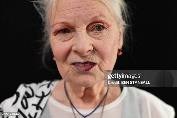 British designer Vivienne Westwood poses for a photograph ahead of a catwalk show of her latest creations at London Fashion Week Men's June 2017 in...