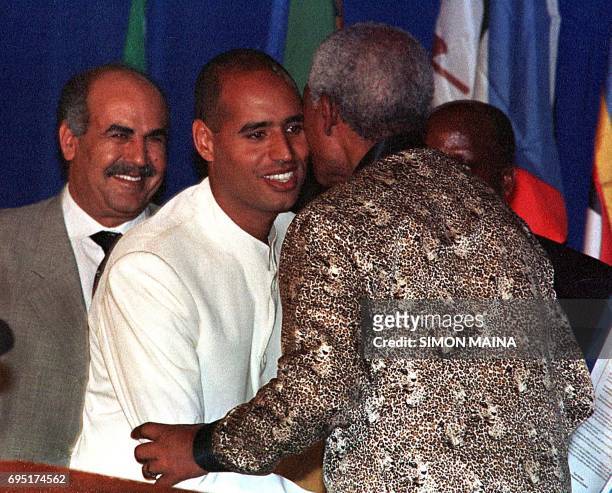 Former South Africa president and chief mediator in Burundi's peace process, Nelson Mandela , welcomes Seif al-Islam Kadhafi, son of Libyan leader...