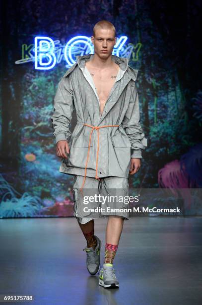 Model walks the runway at the Katie Eary show during the London Fashion Week Men's June 2017 collections on June 12, 2017 in London, England.