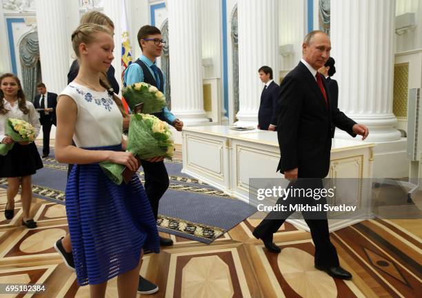 Russian President Vladimir Putin arrives to give a speech during his meeting with children at the Kremlin on June 12, 2017 in Moscow, Russia. Russian...