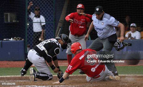Retherford of Piratas de Campeche slides at home as Erick Rodriguez of Guerreros de Oaxaca strikes him out during the match between Piratas de...