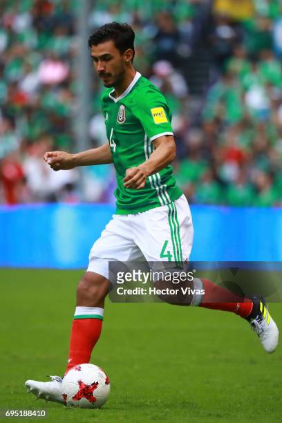 Oswaldo Alanis of Mexico drives the ball during the match between Mexico and The United States as part of the FIFA 2018 World Cup Qualifiers at...