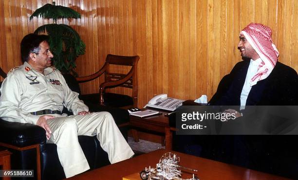 Pakistani President General Pervez Musharraf meets Libyan leader Moamer Kadhafi's son Saif-ul-Islam Kadhafi in Islamabad, 30 November 2002....