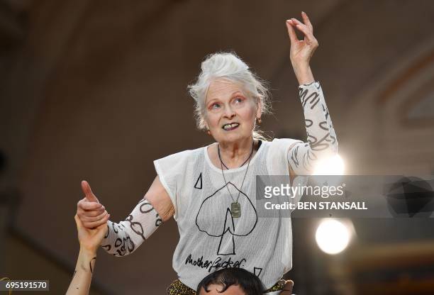 British designer Vivienne Westwood acknowledges the applause following a presentation of her latest designs at London Fashion Week Men's June 2017 in...