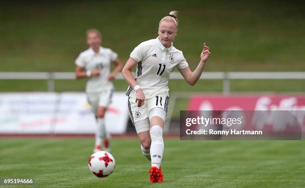 Anna Gerhardt of Germany runs with the ball during the U19 women's elite round match between Germany and Switzerland at Friedensstadion on June 9,...