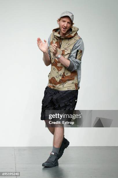 Model walks the runway at the Christopher Raeburn show during the London Fashion Week Men's June 2017 collections on June 11, 2017 in London, England.