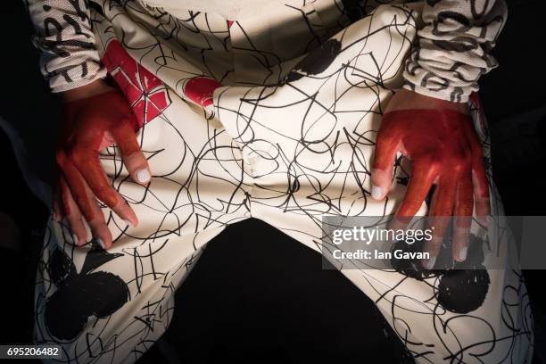 Model backstage ahead of the Vivenne Westwood show during the London Fashion Week Men's June 2017 collections on June 12, 2017 in London, England.