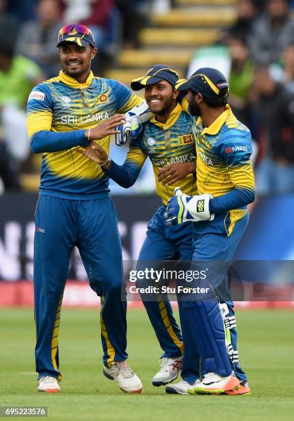 Sri Lanka catcher Kusal Mendis is congratulated after dismissing Azhar Ali during the ICC Champions League match between Sri Lanka and Pakistan at...