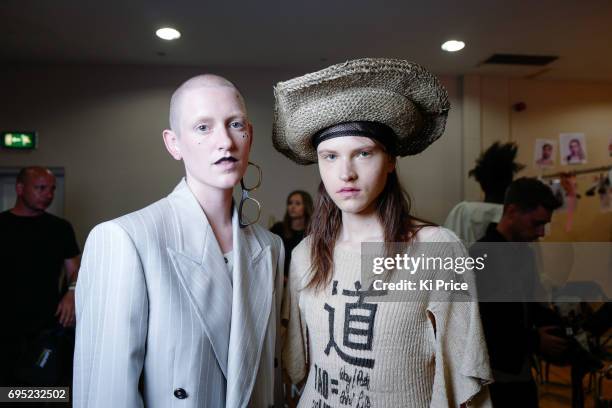 Models backstage ahead of the Vivenne Westwood show during the London Fashion Week Men's June 2017 collections on June 12, 2017 in London, England.