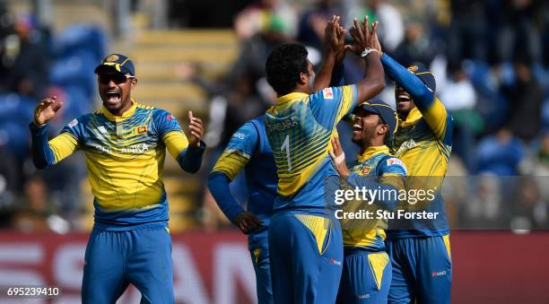 Sri Lanka bowler Thisara Perera is congratulated after running out Pakistan batsman Fahim Ashraf by deflecting a shot onto his stumps during the ICC...