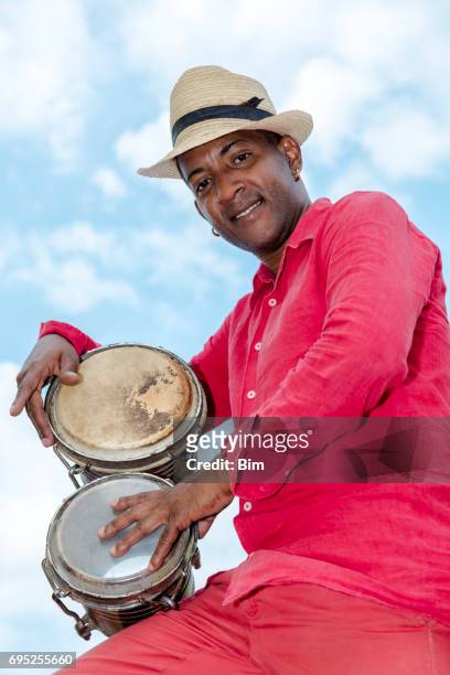 professional cuban conga drum player - conga stock pictures, royalty-free photos & images