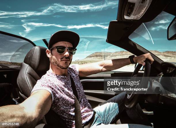 man take a selfie while he is driving - car interior side stock pictures, royalty-free photos & images