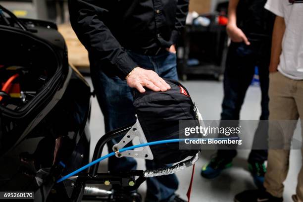 Curt Collins, perforance parts marketing manager for Chevrolet at General Motors Co., describes the parachute on the back of the company's Chevrolet...