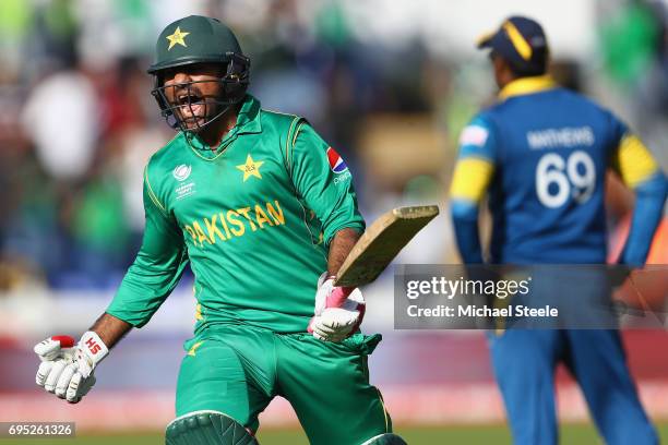 Sarfraz Ahmed of Pakistan celebrates hitting the winning runs and victory by 3 wickets as Sri Lanka captain Angelo Mathews looks on during the ICC...