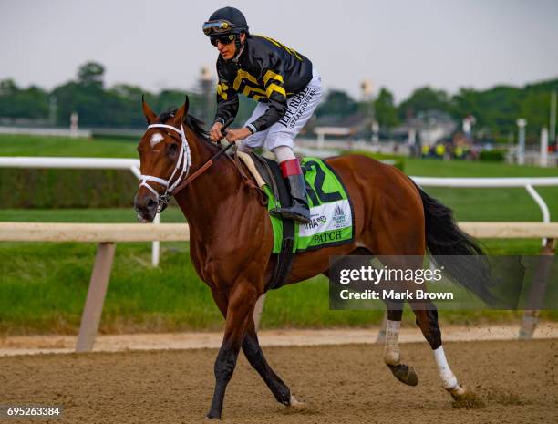 Jockey John Velazquez warms up Patch right before The 149th running of the Belmont Stakes at Belmont Park on June 10, 2017 in Elmont, New York..