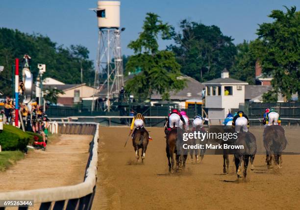 Jockey Rajiv Maragh on Irish War Cry and jockey Jose Ortiz on Tapwrit and the rest of the field battle for the win during The 149th running of the...