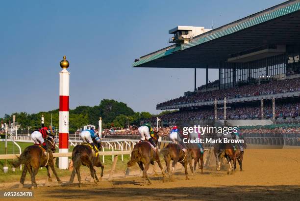 Horses make turn 4 during The 149th running of the Belmont Stakes at Belmont Park on June 10, 2017 in Elmont, New York..