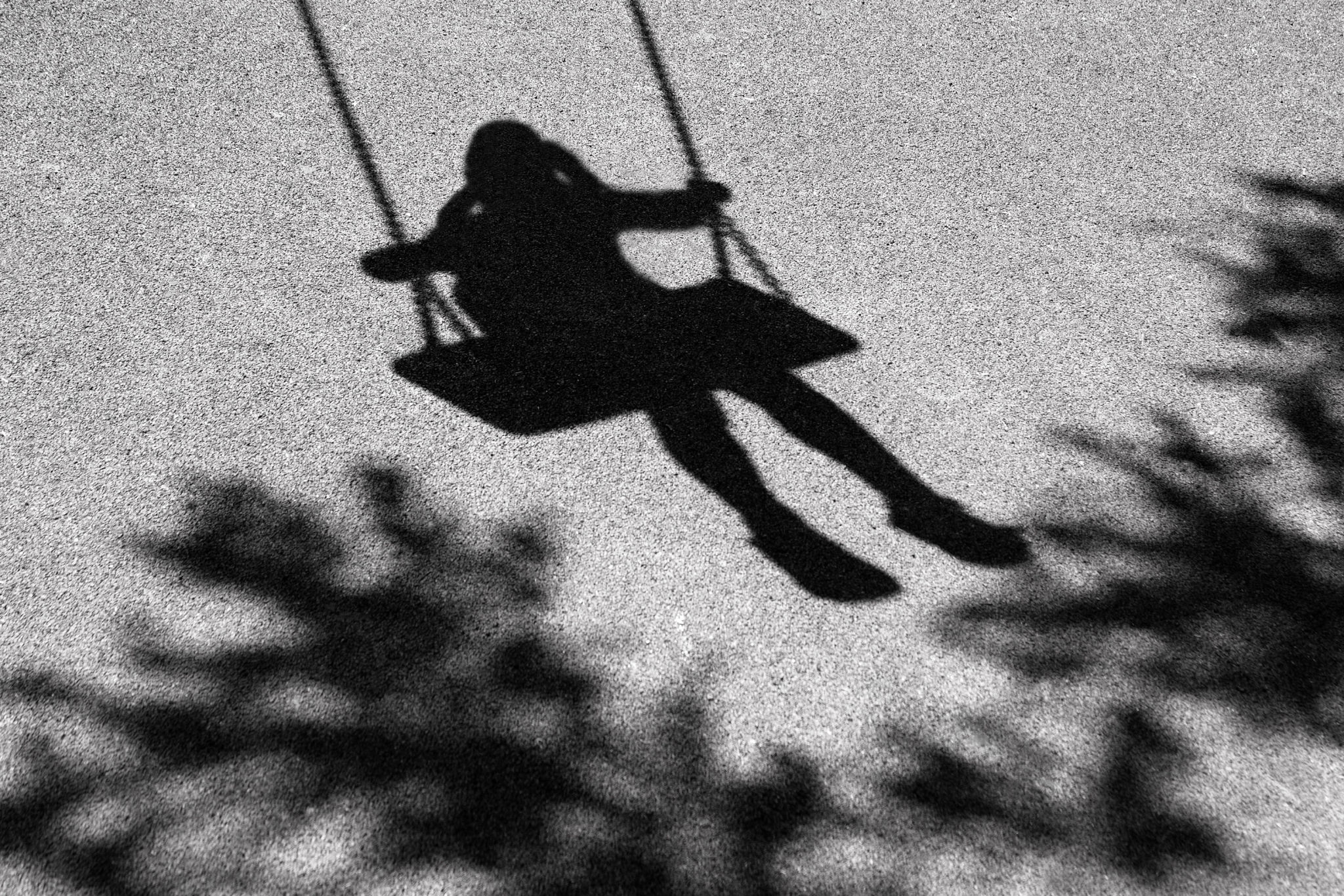Girl on a swing shadow Girl on a swing shadow