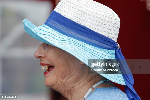 Woman in a blue hat is seen at an arts fare for elderly artists on 10 June, 2017.