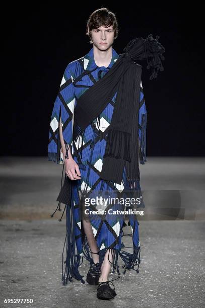 Model walks the runway at the Craig Green Show Spring Summer 2018 fashion show during London Menswear Fashion Week on June 12, 2017 in London, United...