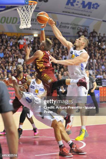 Stefano Tonut of Umana competes with Aaron Craft and Joao Gomes and Luca Lechthaler of Dolomiti during the match game 1of play off final series of...