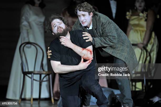 Allan Clayton as Hamlet and Jacques Imbrailo as Horatio with artists of the company in Glyndebourne's production of Brett Dean's Hamlet directed by...