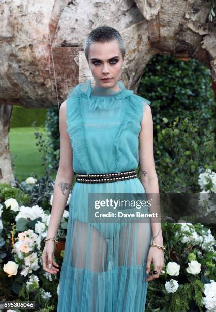 Cara Delevingne attends a dinner hosted by Doutzen Kroes and Lucy Yeomans in honour of Save the Elephants at The Orangery on June 12, 2017 in London,...