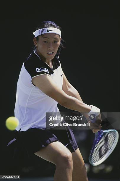Ai Sugiyama of Japan eyes the ball for a back hand return against Iva Majoli during their Women's Singles third round match at the ATP Lipton Tennis...