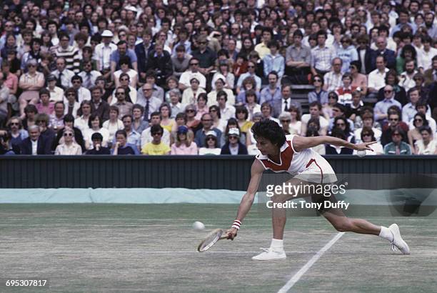 Virginia Wade of Great Britain makes a return against Evonne Goolagong Cawley during their Women's Singles Quarter Final match at the Wimbledon Lawn...