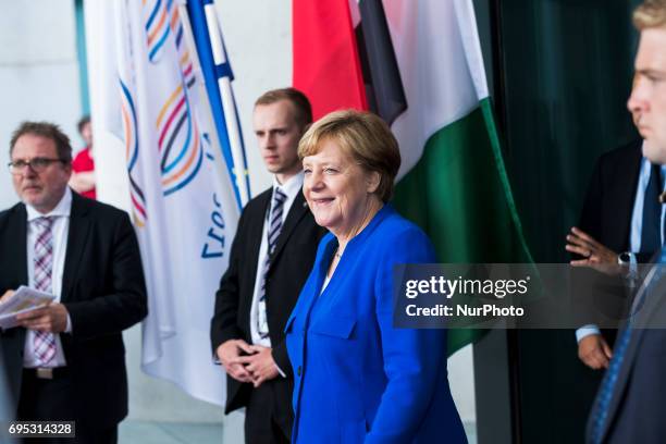 German Chancellor Angela Merkel arrives to greet guests upon their arrival at the Chancellery in Berlin, Germany on June 12, 2017. Germany is holding...