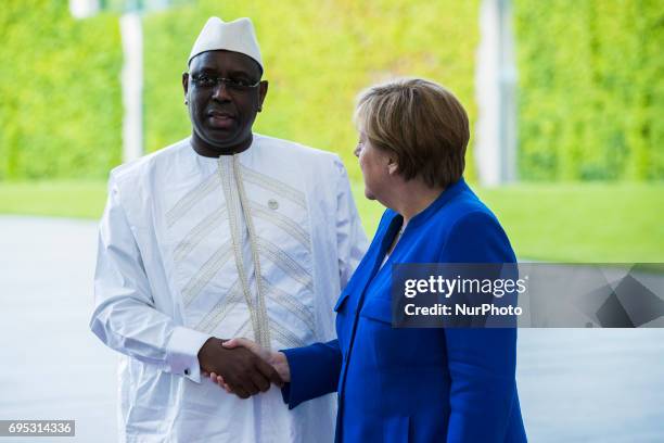 German Chancellor Angela Merkel greets Senegal's President Macky Sall upon his arrival at the Chancellery in Berlin, Germany on June 12, 2017....