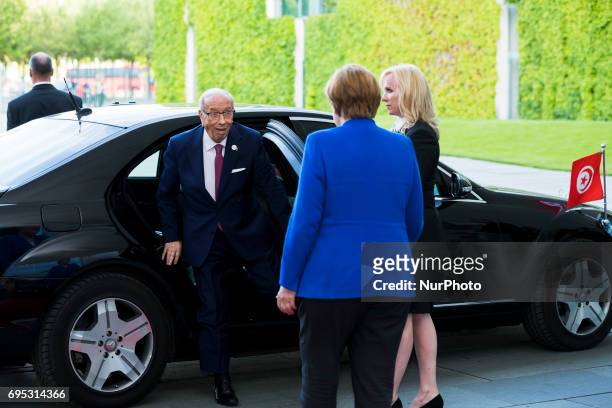 German Chancellor Angela Merkel greets Tunisia's President Beji Caid Essebsi upon his arrival at the Chancellery in Berlin, Germany on June 12, 2017....