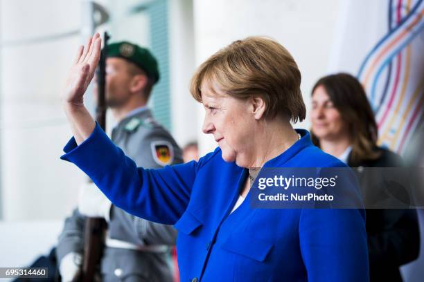 German Chancellor Angela Merkel waves goobye to Egyptian President Abdel Fattah al-Sisi as he leaves the Chancellery in Berlin, Germany on June 12,...